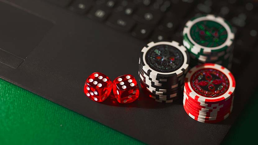 Virtual gambling - dice, chips, laptop